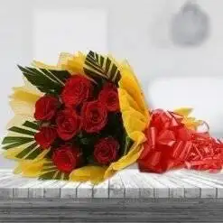 8 Red Roses with Yellow Paper Wrapping