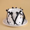 Designer ribbon chocolate cake angled view
