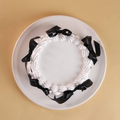 Black and white ribbon chocolate truffle cake
