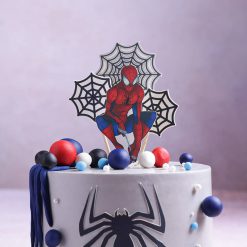 Close detail of Spiderman web theme cake