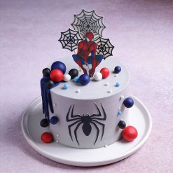 Top view of Spiderman web adventure theme cake