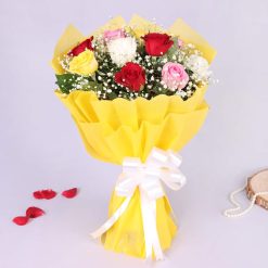 Vanilla cake paired with colourful mixed rose bouquet