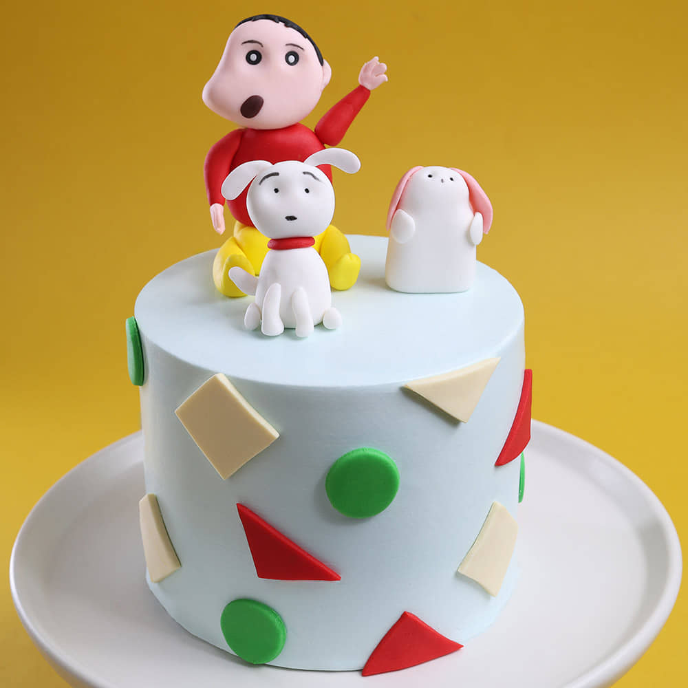 Close view of Shinchan and Shiro theme cake