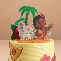 Moana cake close-up with flowers and waves