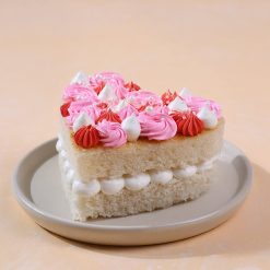 Angled view of blushing heart bento cake