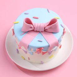 Pastel bow drip cake front view
