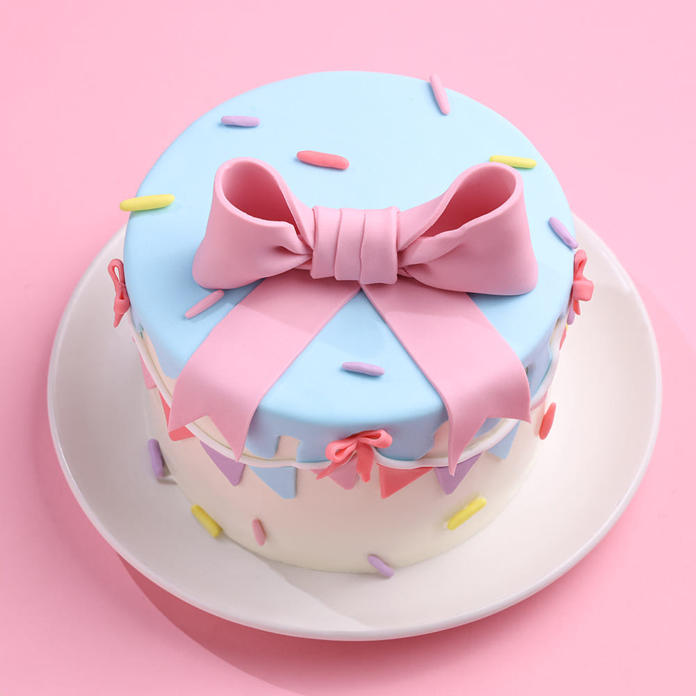 Pastel bow drip cake front view
